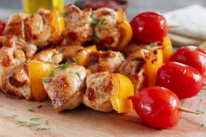 Chicken shish kebab with pepper tomato wooden skewer