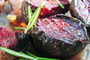Beetroot baked with garlic and rosemary. Concept of vegetarian food.
